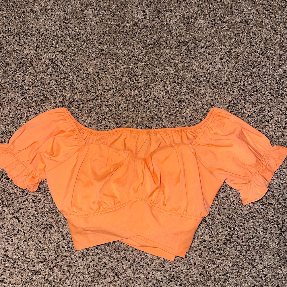 Bright orange off-the-shoulder top